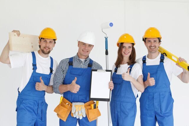 Group of smiling builders